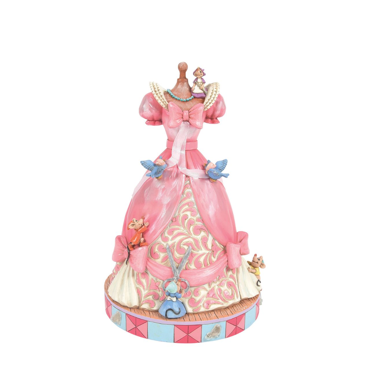 The iconic pink dress from Disney's 1950 masterpiece Cinderella, has been reimagined by artist Jim Shore. With Cinderellas bird and mouse friends, this beautiful dress comes to life. To make this figurine even more special, it plays A Dream is a Wish Your Heart Makes from the film.