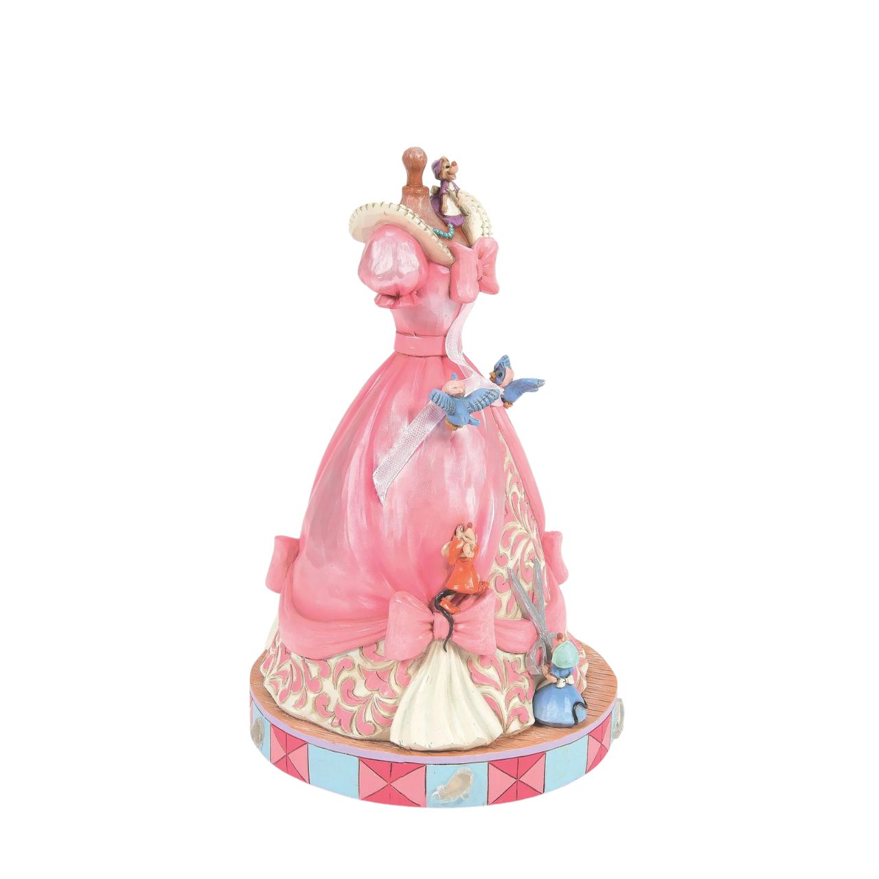 The iconic pink dress from Disney's 1950 masterpiece Cinderella, has been reimagined by artist Jim Shore. With Cinderellas bird and mouse friends, this beautiful dress comes to life. To make this figurine even more special, it plays A Dream is a Wish Your Heart Makes from the film.