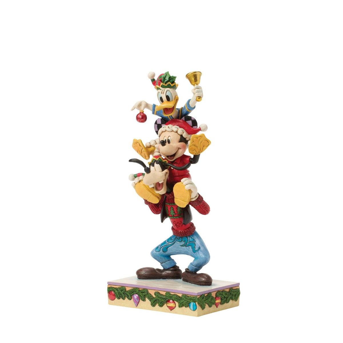 Jim Shore captures Disney's beloved trio in a joyful tower of friendship. With Donald Duck balanced atop Mickey Mouse and Goofy holding steady, this colourful design celebrates laughter, teamwork, and the timeless magic of Disney pals.