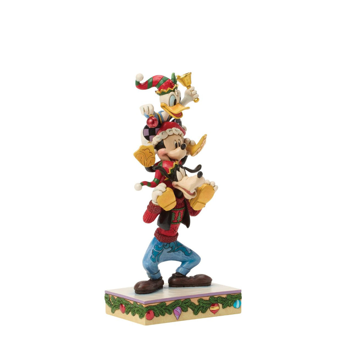 Jim Shore captures Disney's beloved trio in a joyful tower of friendship. With Donald Duck balanced atop Mickey Mouse and Goofy holding steady, this colourful design celebrates laughter, teamwork, and the timeless magic of Disney pals.