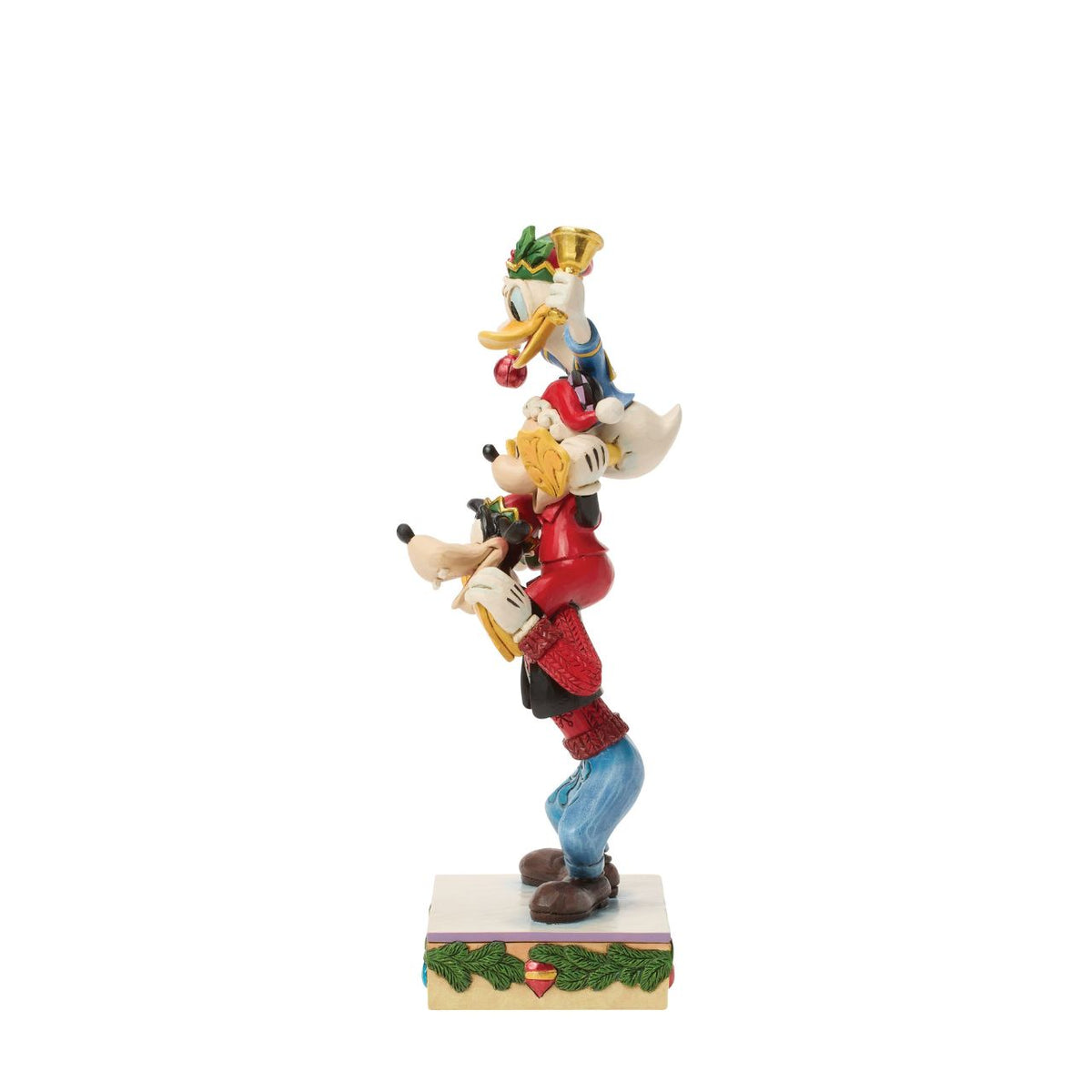 Jim Shore captures Disney's beloved trio in a joyful tower of friendship. With Donald Duck balanced atop Mickey Mouse and Goofy holding steady, this colourful design celebrates laughter, teamwork, and the timeless magic of Disney pals.
