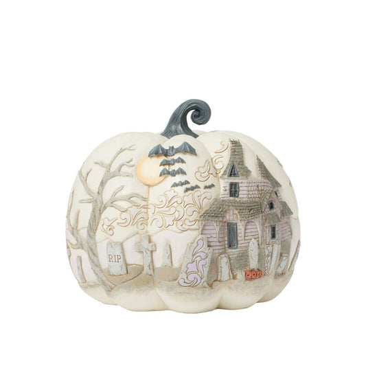 Capture the spirit of Halloween with this eerie Jim Shore pumpkin figurine, showcasing a haunted graveyard scene complete with a spooky haunted house, flying bats, and a full moon. With intricate details and haunting ambiance, prepare to scare.