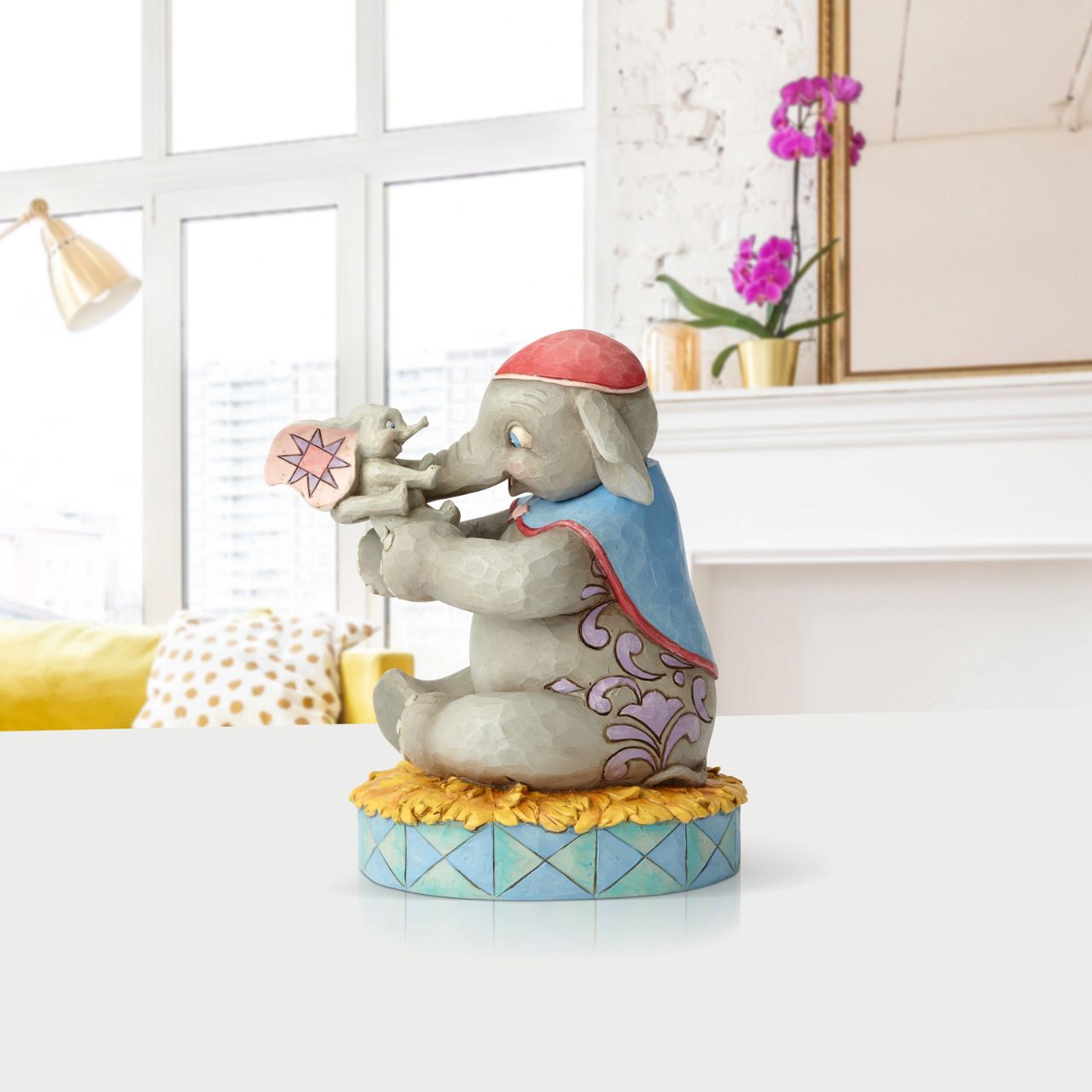 Disney Mrs Jumbo and Dumbo Figurine A Mother's Unconditional Love by Jim Shore  Fiercely protective and unconditionally loving, Mrs. Jumbo cherishes her big-eared baby Dumbo. Handcrafted and hand-painted in exquisite detail, this cast stone figurine by Jim Shore makes a beautiful keepsake for Mother's Day or as a new mum gift.