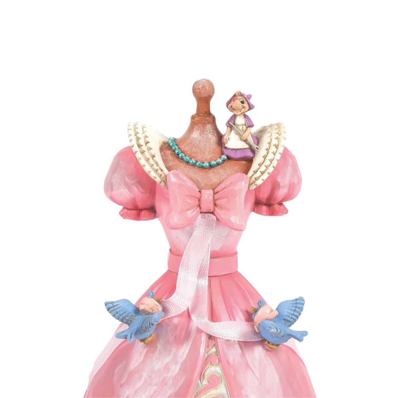 The iconic pink dress from Disney's 1950 masterpiece Cinderella, has been reimagined by artist Jim Shore. With Cinderellas bird and mouse friends, this beautiful dress comes to life. To make this figurine even more special, it plays A Dream is a Wish Your Heart Makes from the film.