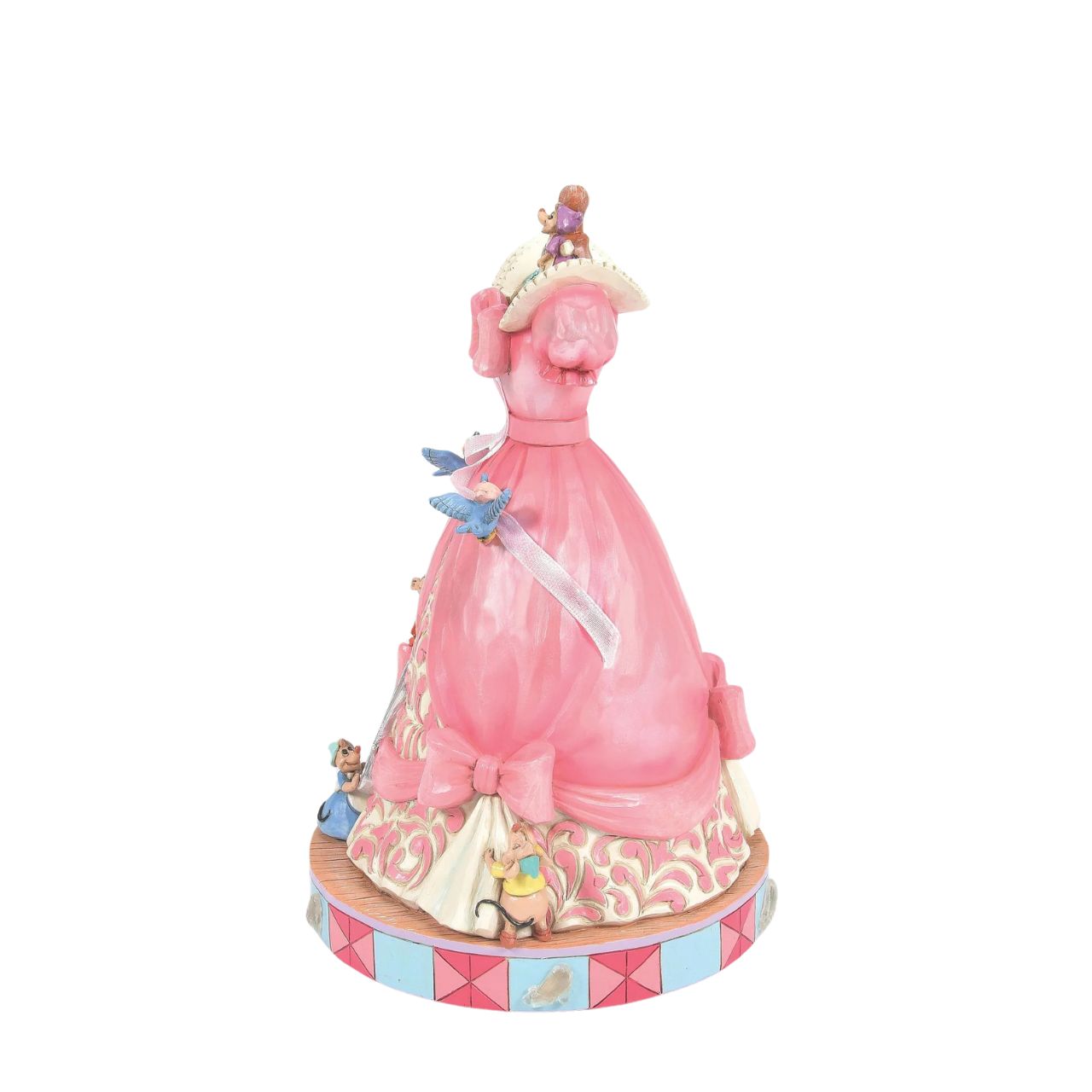 The iconic pink dress from Disney's 1950 masterpiece Cinderella, has been reimagined by artist Jim Shore. With Cinderellas bird and mouse friends, this beautiful dress comes to life. To make this figurine even more special, it plays A Dream is a Wish Your Heart Makes from the film.