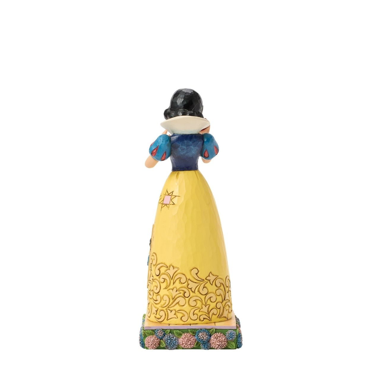 Snow White's story is told upon her gown in this sculpted scene from the creative mind of Jim Shore.