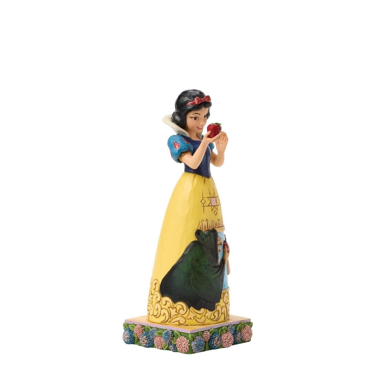 Snow White's story is told upon her gown in this sculpted scene from the creative mind of Jim Shore.