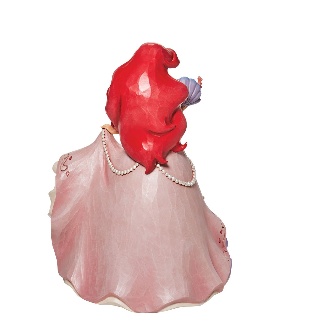 "A Precious Pearl" Second in the Series of Deluxe Figurines, The Enchanted Princess Series, is this striking 40cm Ariel Figurine. Thanks to the magic of a mysterious sea witch, Ariel The Little Mermaid, grows legs to walk on land. This sparkling Jim Shore figurine features the princess at her prettiest, her gown fitted with shells and jewels, she holds an oyster with a pearl.