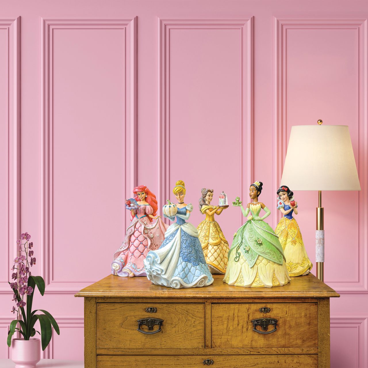 "A Precious Pearl" Second in the Series of Deluxe Figurines, The Enchanted Princess Series, is this striking 40cm Ariel Figurine. Thanks to the magic of a mysterious sea witch, Ariel The Little Mermaid, grows legs to walk on land. This sparkling Jim Shore figurine features the princess at her prettiest, her gown fitted with shells and jewels, she holds an oyster with a pearl.