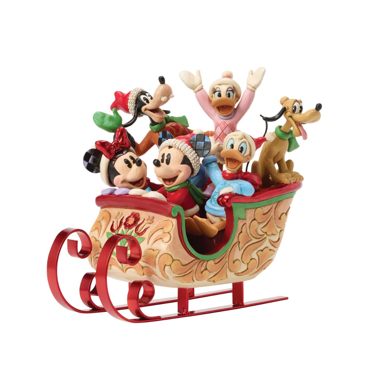 Celebrate the season with Jim Shore's enchanting Christmas sleigh ride featuring Mickey, Minnie, Donald, Daisy, Goofy, and Pluto bundled together in a beautifully crafted sleigh. Decorated with vibrant rosemaling patterns and gleaming metal runners.