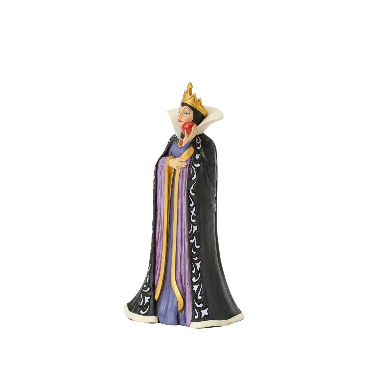 The Queen, Grimhilde, wears a striking black and purple gown adorned with Jim Shore's signature rosemaling and quilt patterns. Holding a poisoned apple meant for Snow White, her jealous heart fuels her dark intentions as she plots her next move.