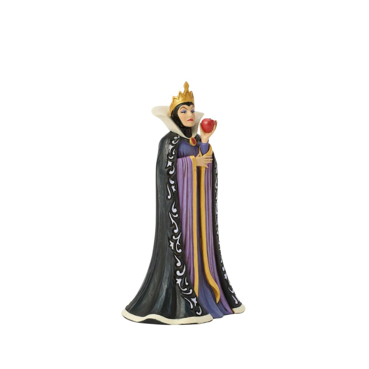 The Queen, Grimhilde, wears a striking black and purple gown adorned with Jim Shore's signature rosemaling and quilt patterns. Holding a poisoned apple meant for Snow White, her jealous heart fuels her dark intentions as she plots her next move.