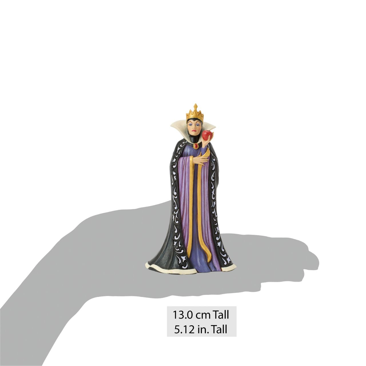 The Queen, Grimhilde, wears a striking black and purple gown adorned with Jim Shore's signature rosemaling and quilt patterns. Holding a poisoned apple meant for Snow White, her jealous heart fuels her dark intentions as she plots her next move.