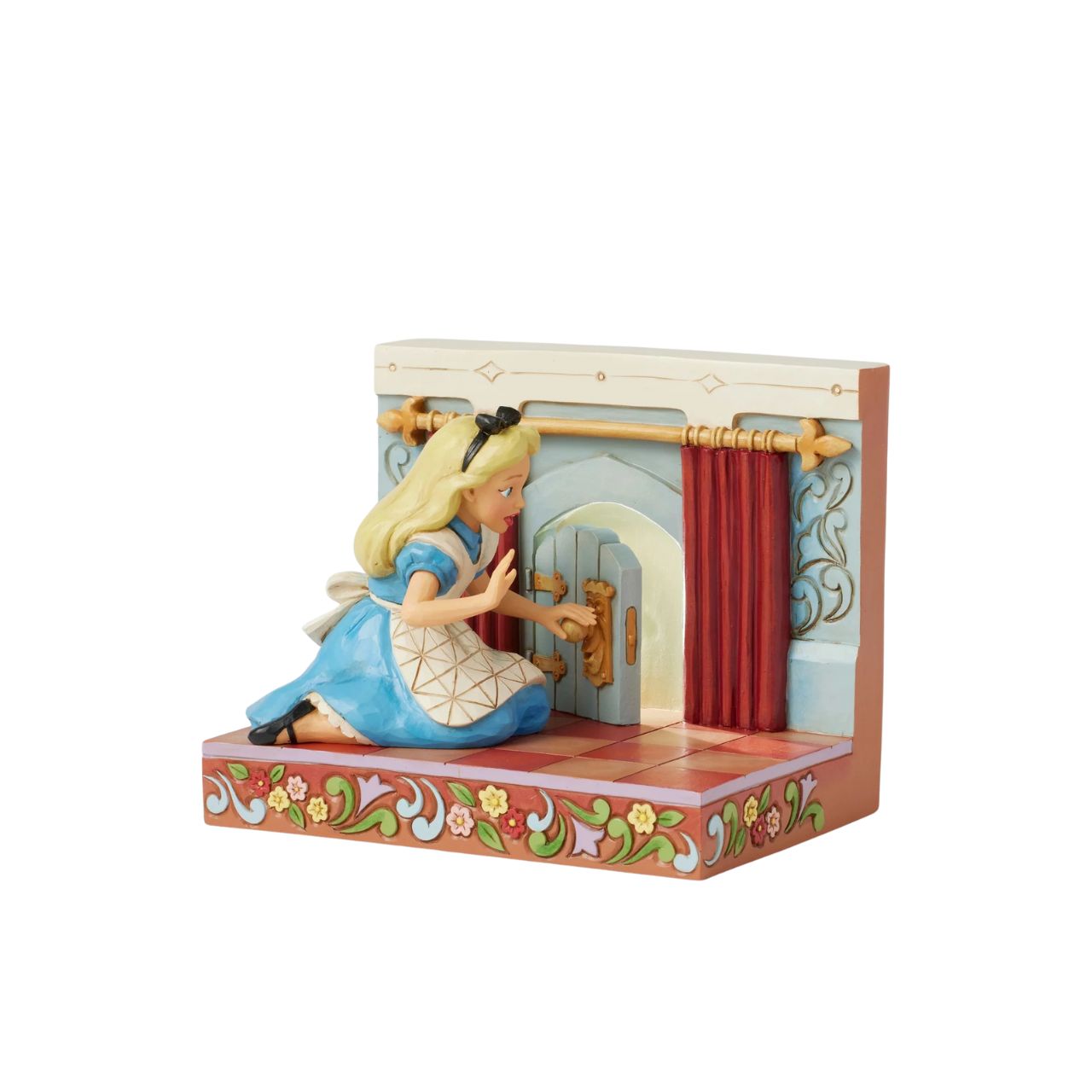 Alice eagerly opens the door to Wonderland, twisting the smiling doorknob while the curtains draw back to reveal the enchanting realm beyond. With inviting LED lights, this captivating Jim Shore scene captures the curiosity of Alice's adventure.