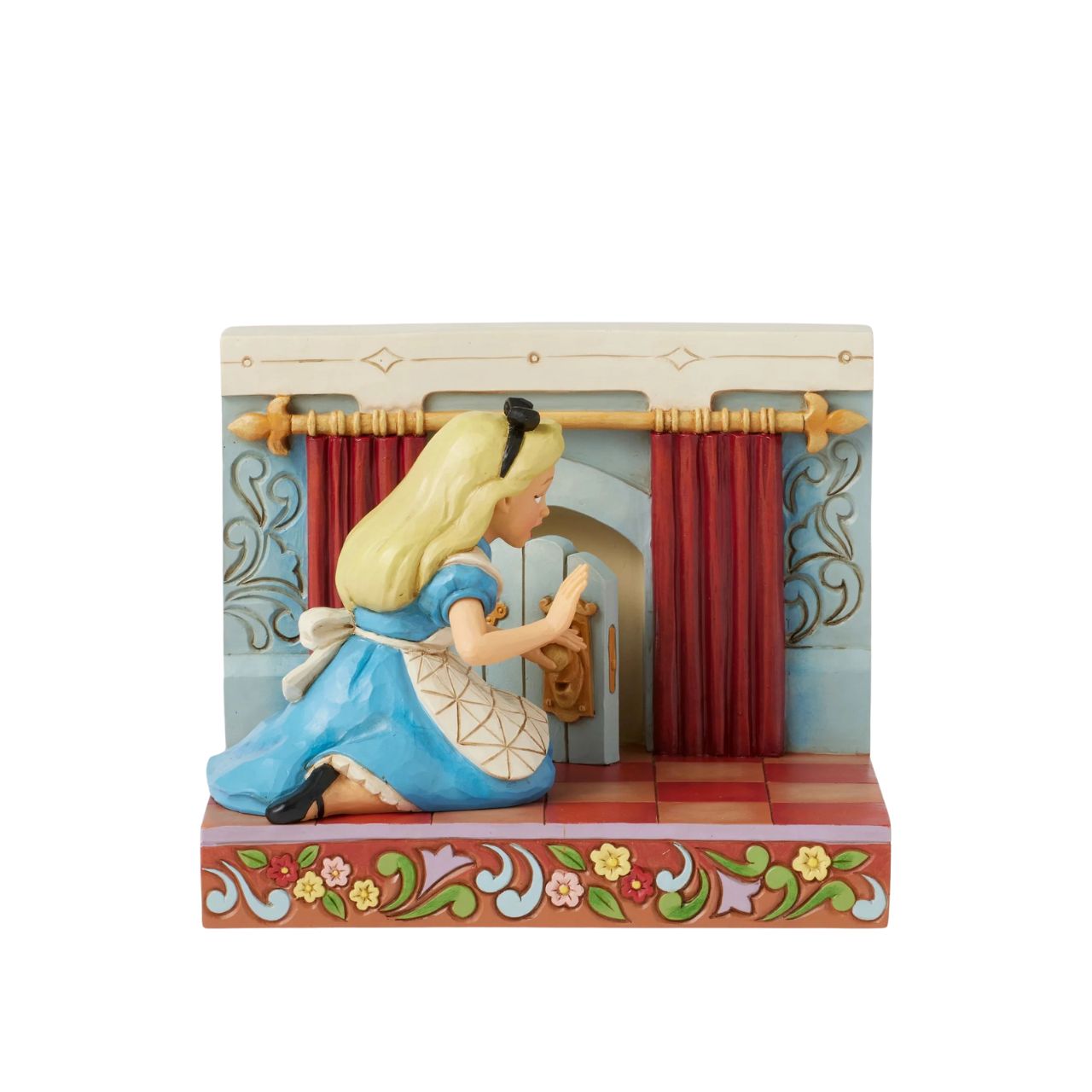 Alice eagerly opens the door to Wonderland, twisting the smiling doorknob while the curtains draw back to reveal the enchanting realm beyond. With inviting LED lights, this captivating Jim Shore scene captures the curiosity of Alice's adventure.