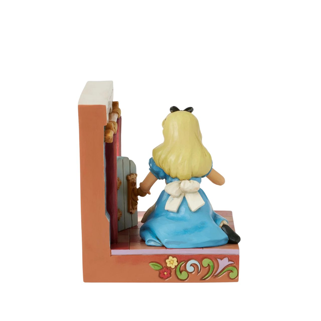 Alice eagerly opens the door to Wonderland, twisting the smiling doorknob while the curtains draw back to reveal the enchanting realm beyond. With inviting LED lights, this captivating Jim Shore scene captures the curiosity of Alice's adventure.