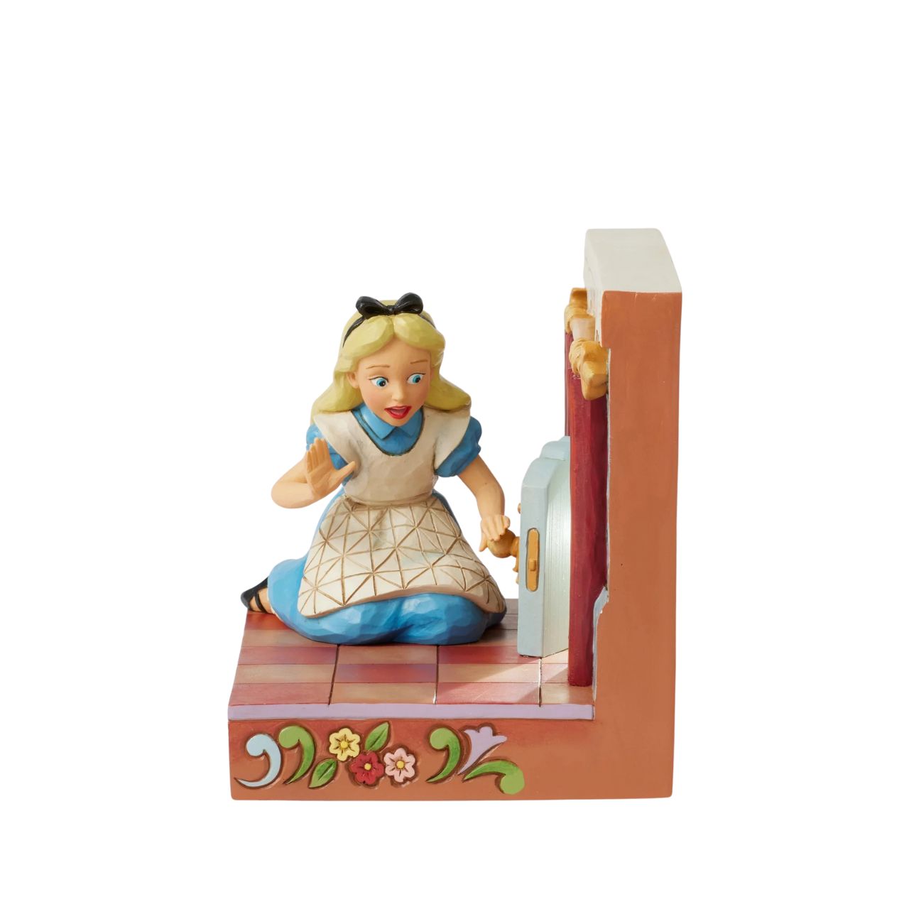 Alice eagerly opens the door to Wonderland, twisting the smiling doorknob while the curtains draw back to reveal the enchanting realm beyond. With inviting LED lights, this captivating Jim Shore scene captures the curiosity of Alice's adventure.