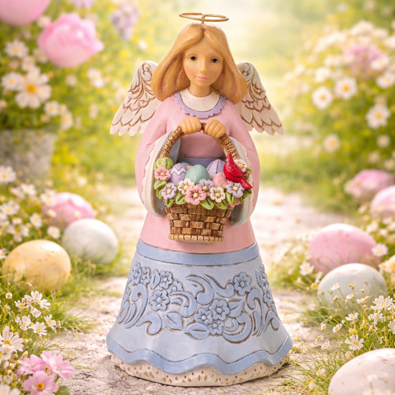 "Basket of Easter Blessings" This charming Angel from the artistry of Jim Shore holds an Easter Basket adorned with flowers and full of eggs in this heartfelt holiday design. She's beautifully handcrafted in soft pastels and features Jim's signature folk-art inspired motifs.