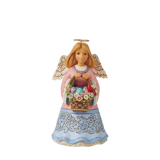 Angel with Basket of Easter Blessings Figurine Pint Sized by Heartwood Creek  "Basket of Easter Blessings" This charming Angel from the artistry of Jim Shore holds an Easter Basket adorned with flowers and full of eggs in this heartfelt holiday design.
