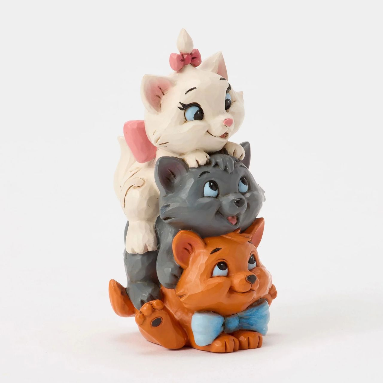 This charming Jim Shore design features the Aristocats kittens playfully stacked together. Toulouse forms the base as Berlioz and Marie balance on top, with bright smiles. The spoiled trio is about to learn some big lessons after being kidnapped.