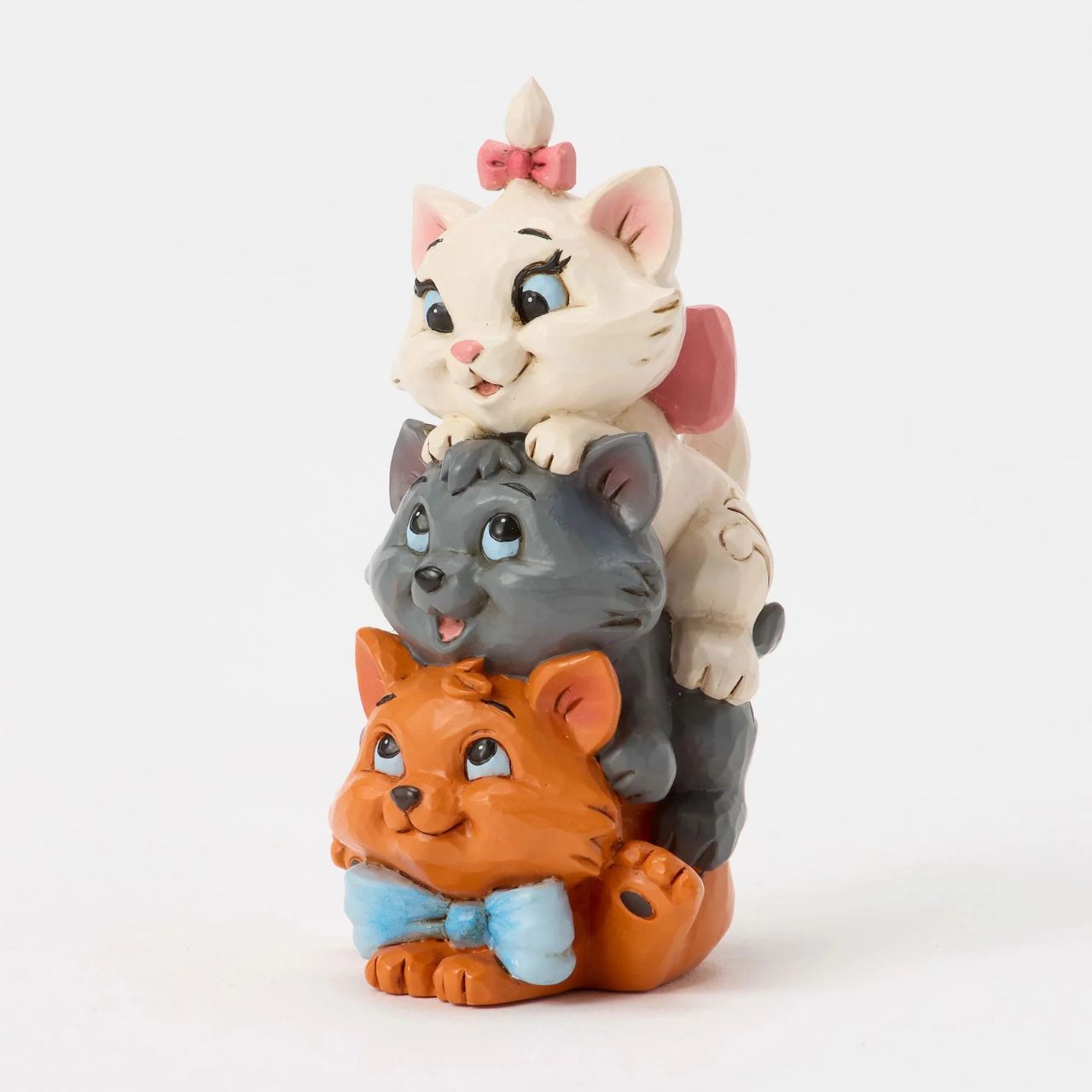 This charming Jim Shore design features the Aristocats kittens playfully stacked together. Toulouse forms the base as Berlioz and Marie balance on top, with bright smiles. The spoiled trio is about to learn some big lessons after being kidnapped.
