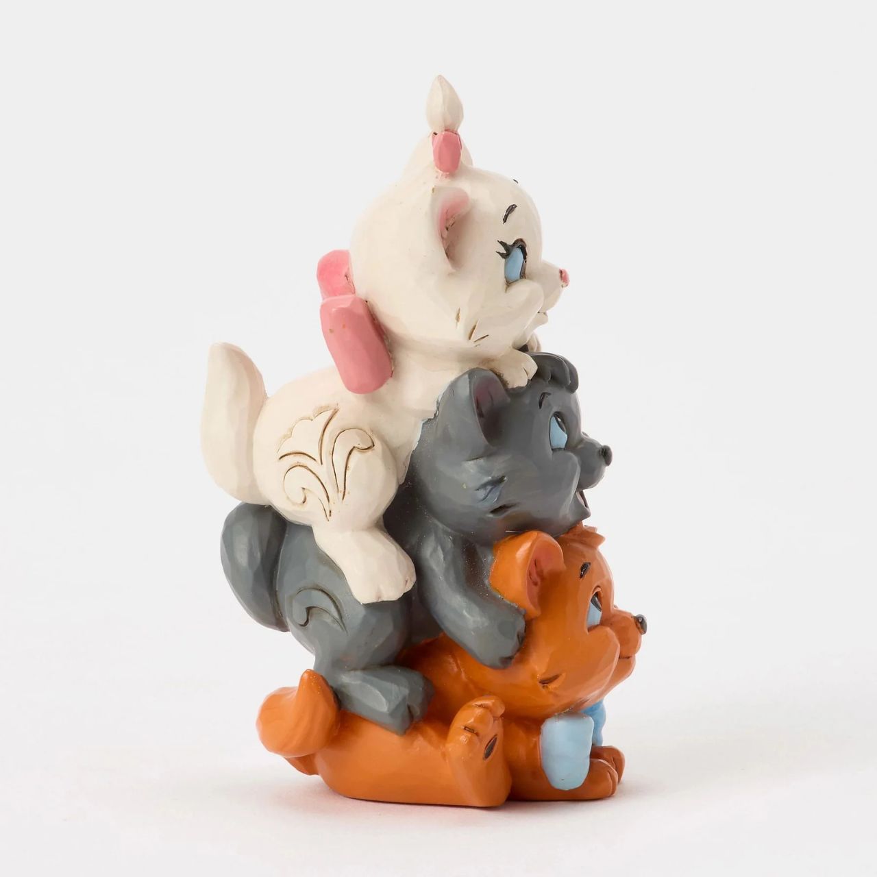 This charming Jim Shore design features the Aristocats kittens playfully stacked together. Toulouse forms the base as Berlioz and Marie balance on top, with bright smiles. The spoiled trio is about to learn some big lessons after being kidnapped.