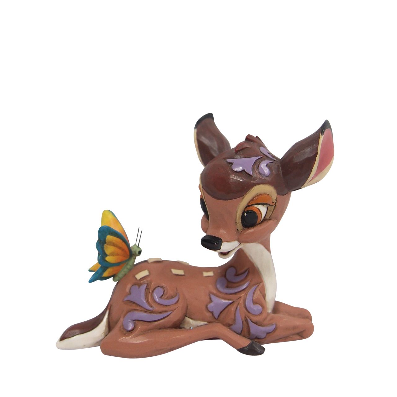 Disney Traditions Bambi Mini Figurine  With pleasing rosemaling detail and beautiful craftsmanship, this lovely Disney piece is a prize from the forest. Jim Shore celebrates the 80th anniversary of Bambi with this sweet miniature, as the peaceful deer sits gracefully with a butterfly.