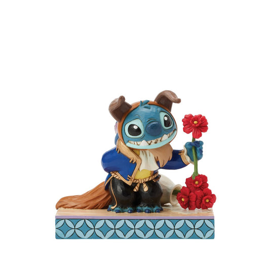 In this charming Jim Shore design, Stitch takes on the role of the Beast from Disney's beloved tale, dressed in the iconic blue suit. With an adorable smile, Stitch presents a flower, to you the collector.