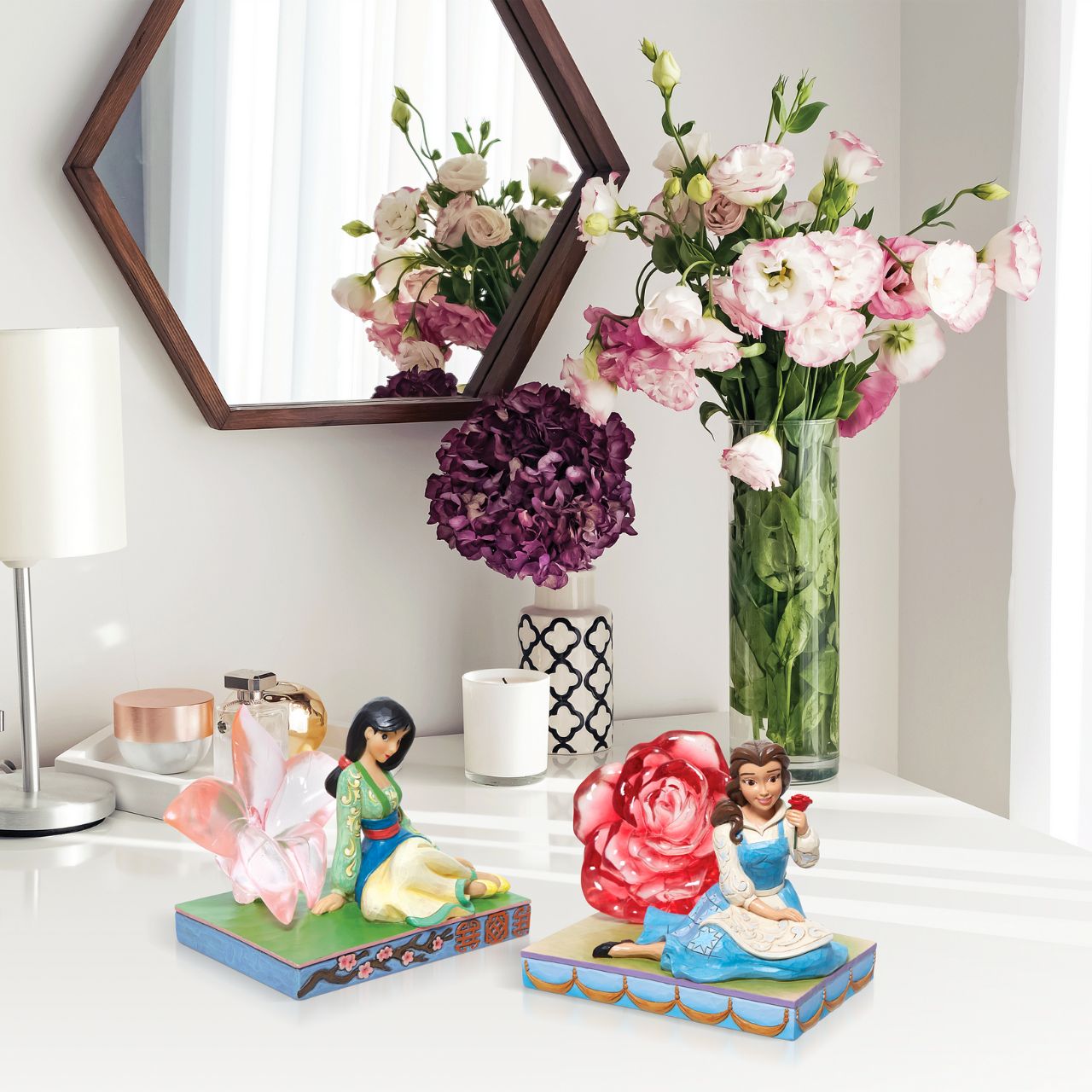 Disney Belle with Clear Resin Rose by Jim Shore  This Disney Traditions line by Jim Shore features iconic Walt Disney princesses with their famous props highlighted. With a base illustrating her story, this piece features Belle with a with her signature red rose.