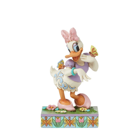 Donald Ducks super cute girlfriend Daisy Duck is here to celebrate the joy of Spring. Hand crafted and painted, she is part of the Disney Traditions collection by Jim Shore. Comes in a fully branded gift box.