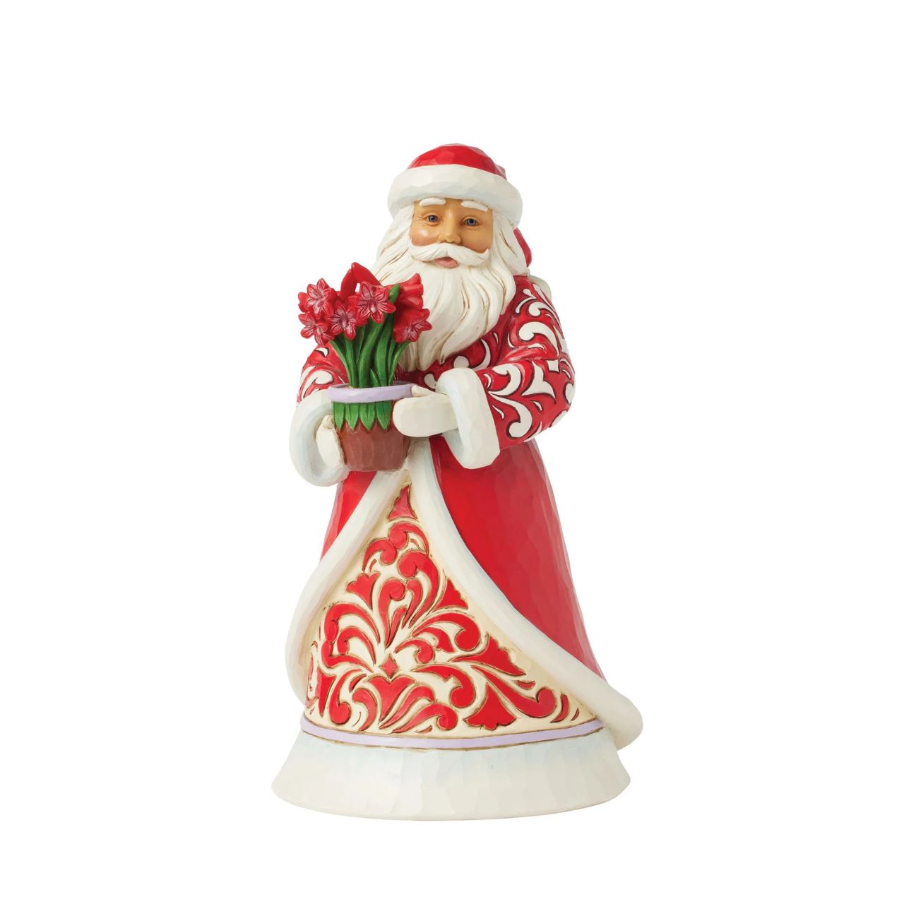 With a peaceful smile, this Jim Shore Santa holds a vase of vibrant amaryllis flowers, symbolizing the beauty and resilience of winter. His intricately patterned rosemaling coat adds a timeless touch of serenity to your holiday home décor.