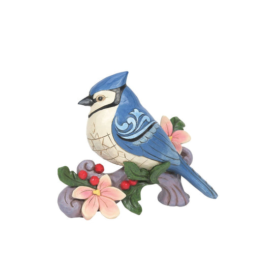 Blue Jay Figurine by Jim Shore  Bring the great outdoors inside with this gorgeous bird bust. Sitting on a branch covered in flowers, this 5 Blue Jay brings grace to any home. Jim Shore's trademark patchwork and rosemale details are complimented by the bust's bright colour.