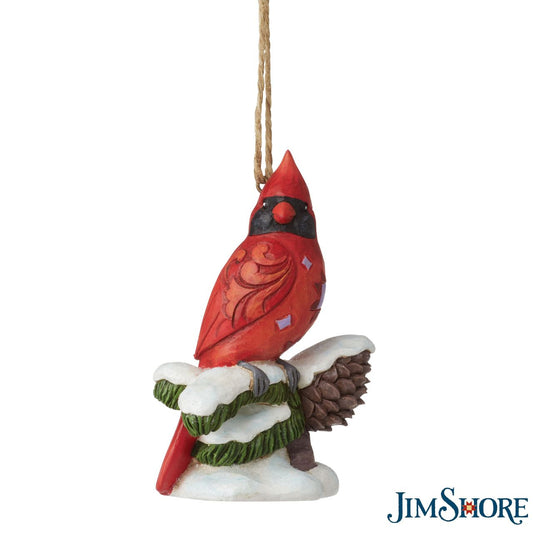 Carving Cardinal Hanging Ornament by Jim Shore  Celebrate Christmas with this beautiful hand crafted and hand painted Carving Cardinal on Snowy Branch Hanging Ornament. Decorate your tree this Christmas with this Carving Cardinal on Snowy Branch Hanging Ornament.