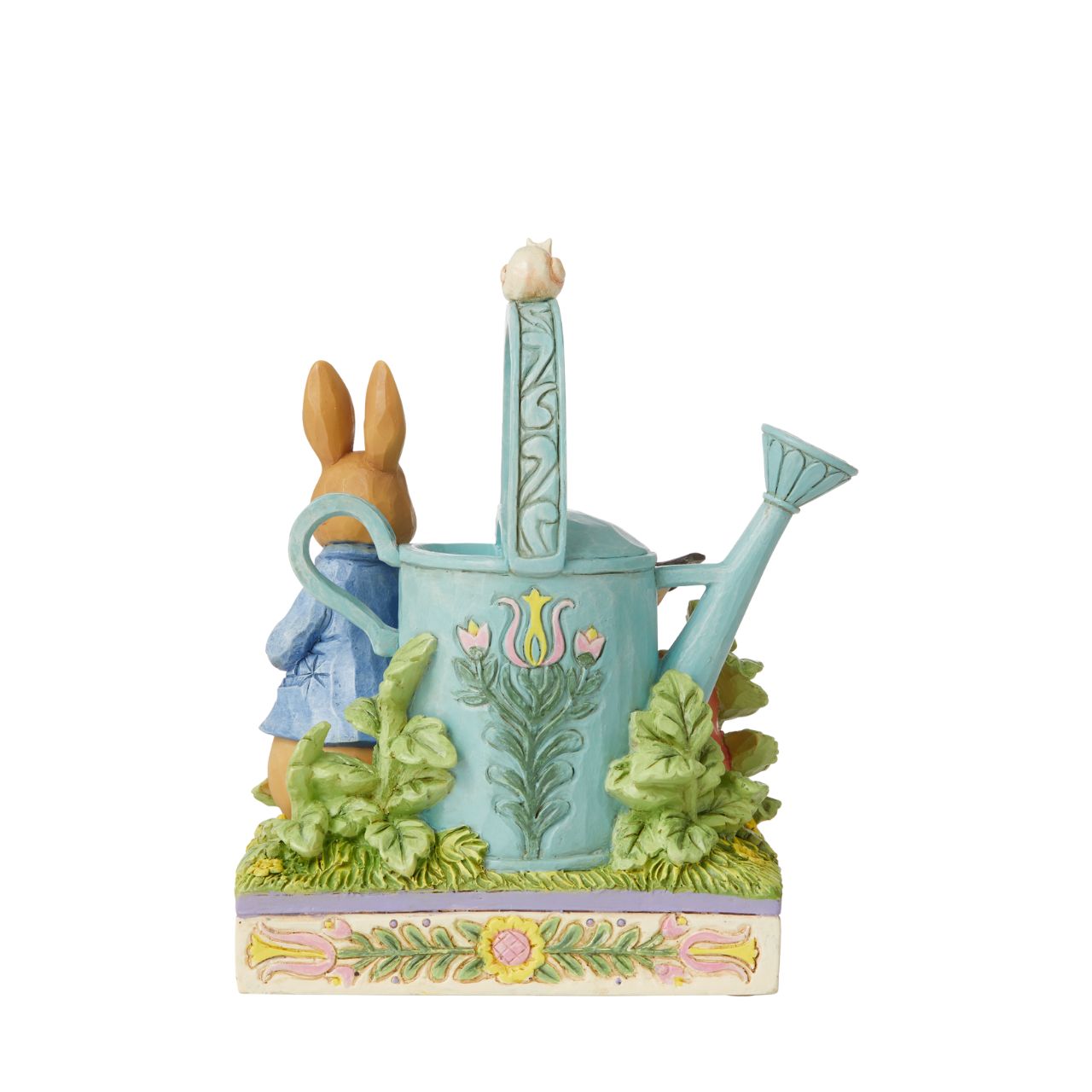 Award winning folk artist Jim Shore brings his unique style to Beatrix Potter's beloved story, The Tale of Peter Rabbit, through charming hand-crafted gifts that will delight her readers of all ages. This Jim Shore figurine features the adventurous Rabbit after he's squeezed under the garden gate to gorge on Mr. McGregor's garden vegetables again.