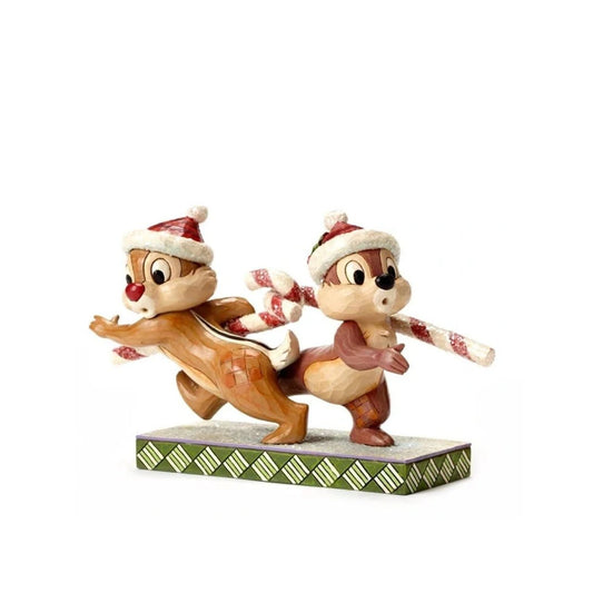 "Candy Cane Caper" Chip and Dale work at charming cross purposes in this beguiling design from the artistry of Jim Shore. Beautifully decorated with sparkling sugary accents, this comical Christmas piece blends Jim's distinctive style with the enduring humour of Disney.