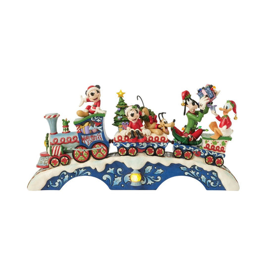 This fantastic Jim Shore Mickey Mouse Express chugs along a snowy track, bringing festive cheer as it lights up and plays eight beloved Christmas tunes. With intricate details, the train showcases Mickey and his friends, trees, gifts, and lights.