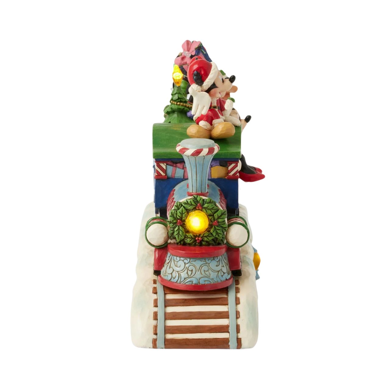 This fantastic Jim Shore Mickey Mouse Express chugs along a snowy track, bringing festive cheer as it lights up and plays eight beloved Christmas tunes. With intricate details, the train showcases Mickey and his friends, trees, gifts, and lights.