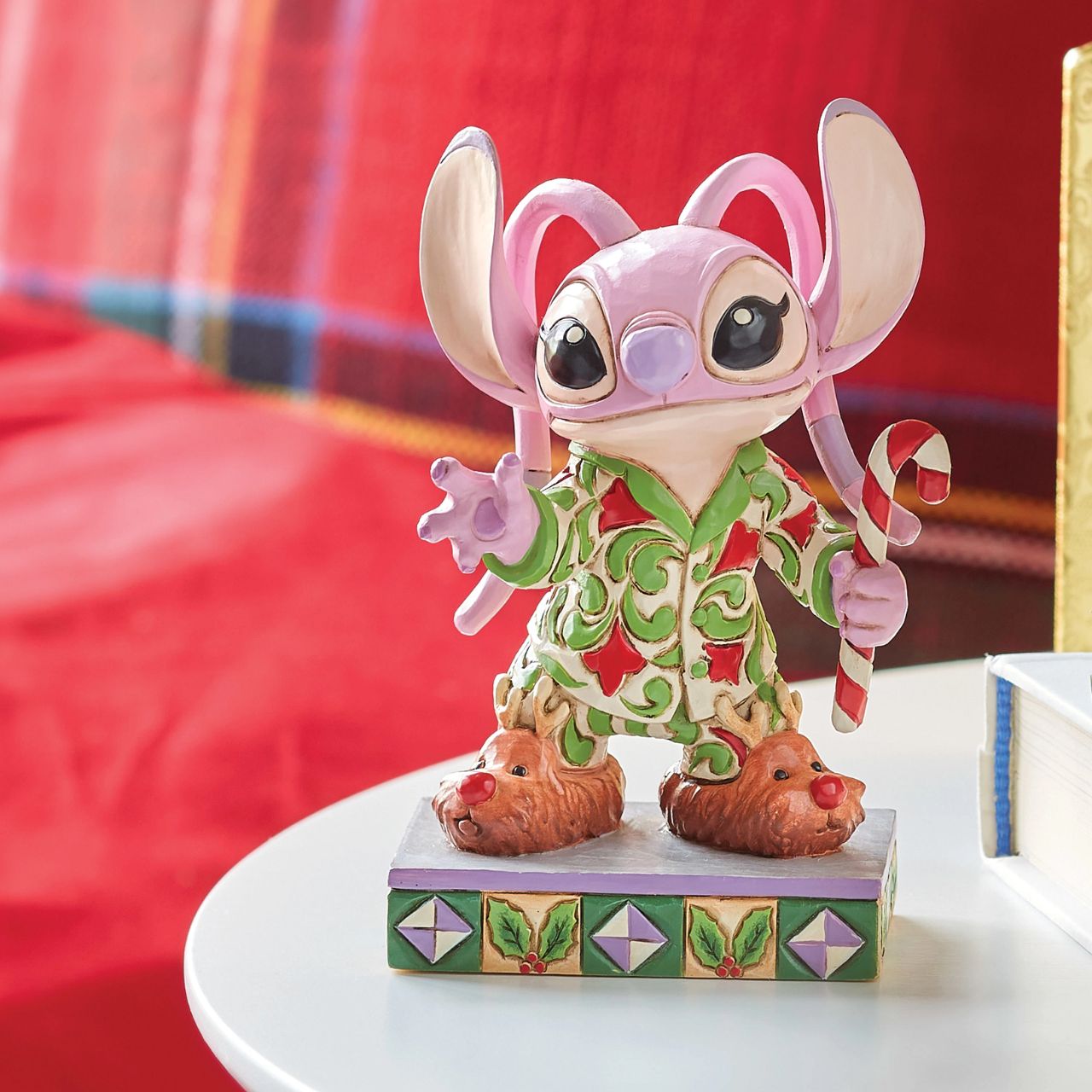 Angel is ready to celebrate Christmas with Stitch in her festive pjs. Comes in a fully branded gift box from Disney Traditions.&nbsp;