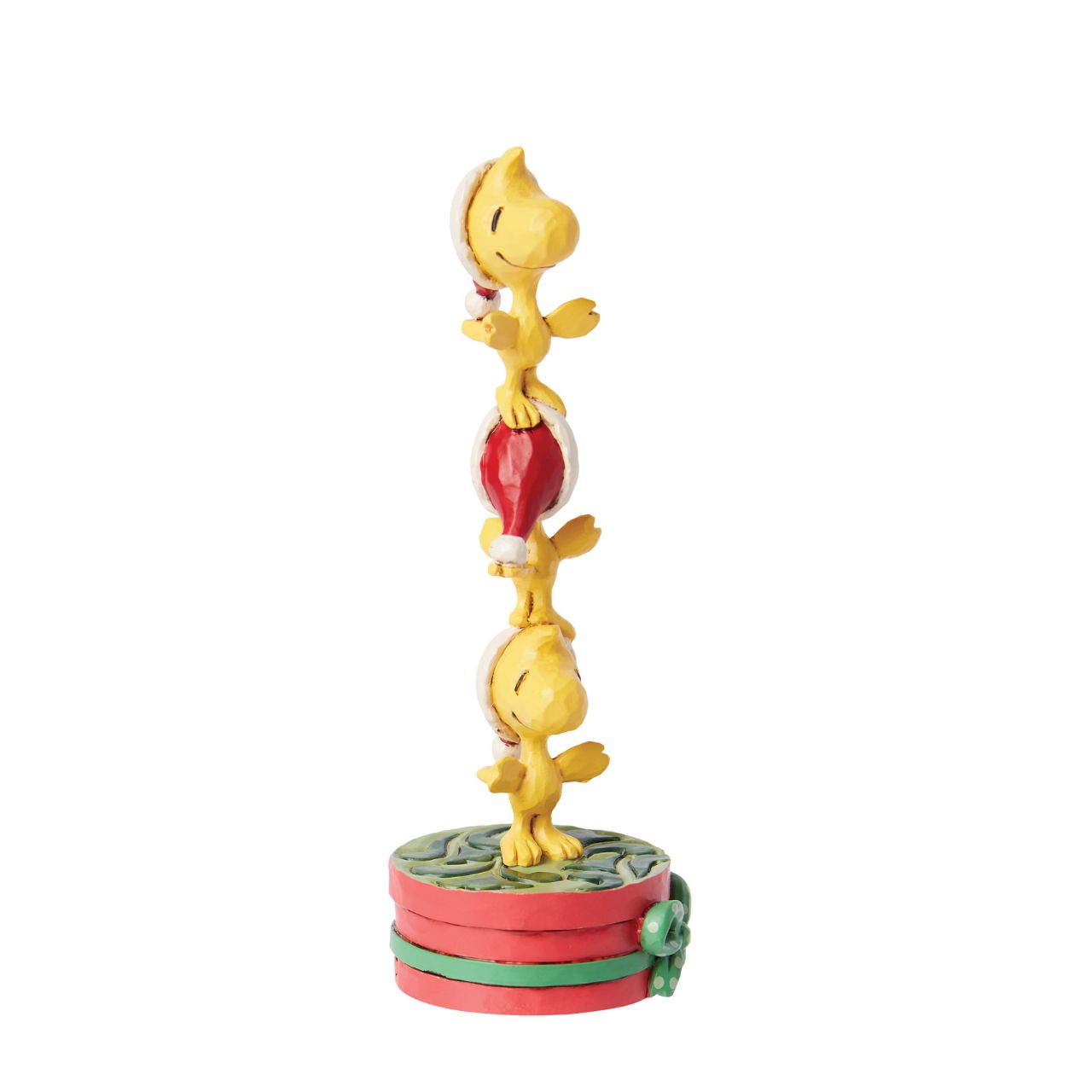 Celebrate Woodstock's 60th anniversary with this adorable creation from Jim Shore. Woodstock and his brothers don Santa hats and form a tower standing on one another's heads. With rosemale details, the trio delights with stacked holiday spirit.