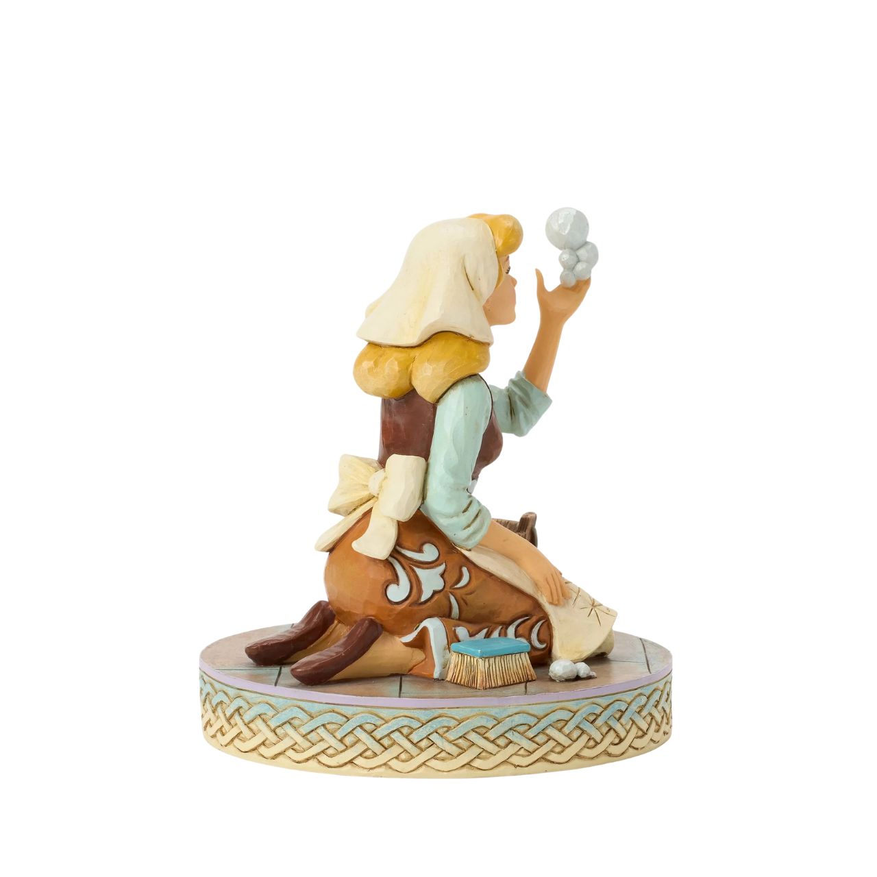 Cinderella's spirit remains unbroken in this inspiring Jim Shore scene. Dressed as a maid, she finds joy in her work, catching a bubble as she scrubs the floors. Jim Shore's enchanting details capture her beauty and resilience.