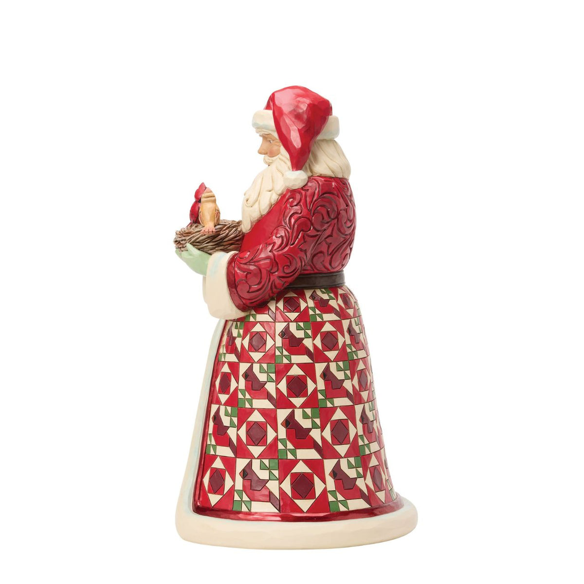 Celebrate the warmth of the season with this distinguished Collector's Edition Santa from Jim Shore's Heartwood Creek collection. Standing proudly with a nest of cardinals nestled in his arms, this beautifully crafted design reveals a charming surprise inside – delicate cardinal eggs waiting to be discovered.