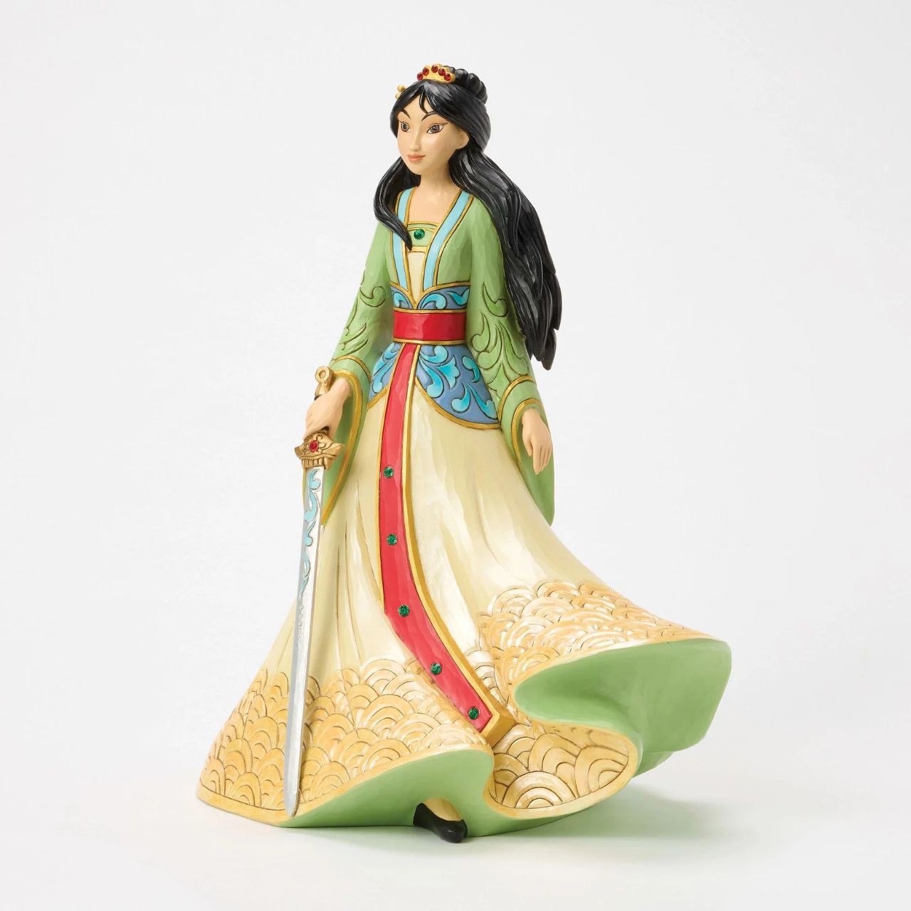 This exquisite Jim Shore deluxe princess bust showcases Mulan in her finest dress, carrying a sword with bravery and strength. With traditional makeup and cherished Chinese symbols, she captivates with beauty, legacy, and courage.