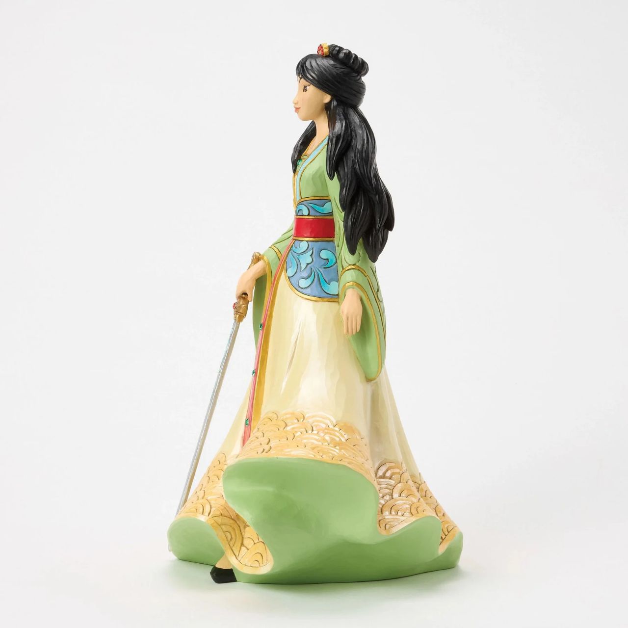 This exquisite Jim Shore deluxe princess bust showcases Mulan in her finest dress, carrying a sword with bravery and strength. With traditional makeup and cherished Chinese symbols, she captivates with beauty, legacy, and courage.