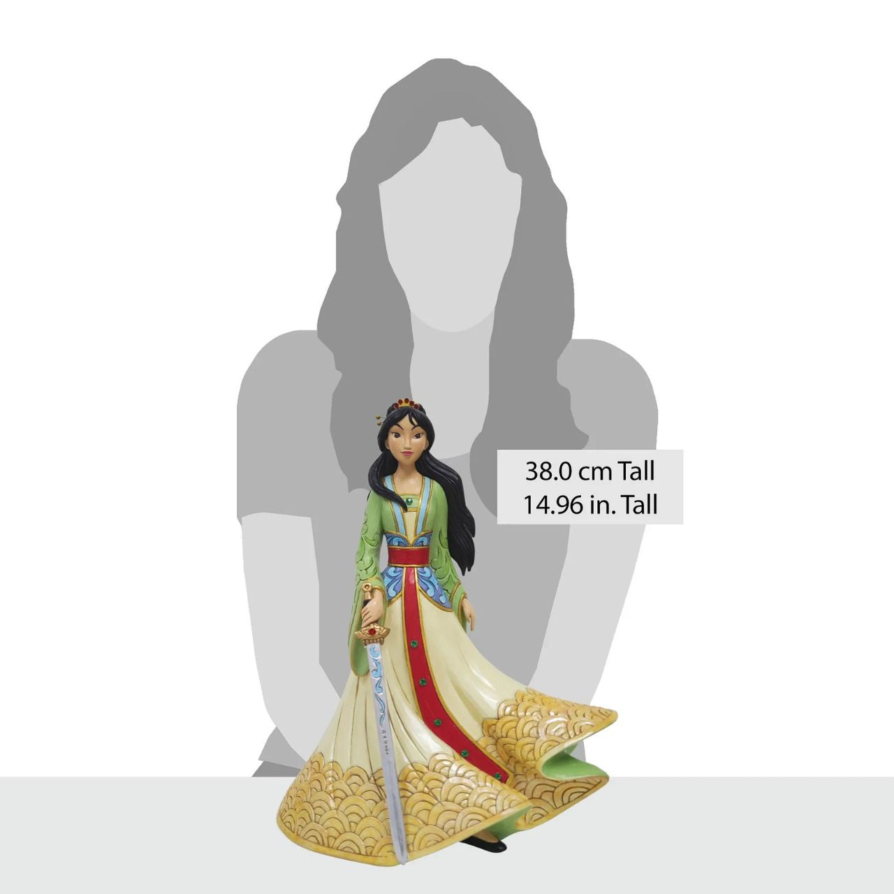 This exquisite Jim Shore deluxe princess bust showcases Mulan in her finest dress, carrying a sword with bravery and strength. With traditional makeup and cherished Chinese symbols, she captivates with beauty, legacy, and courage.