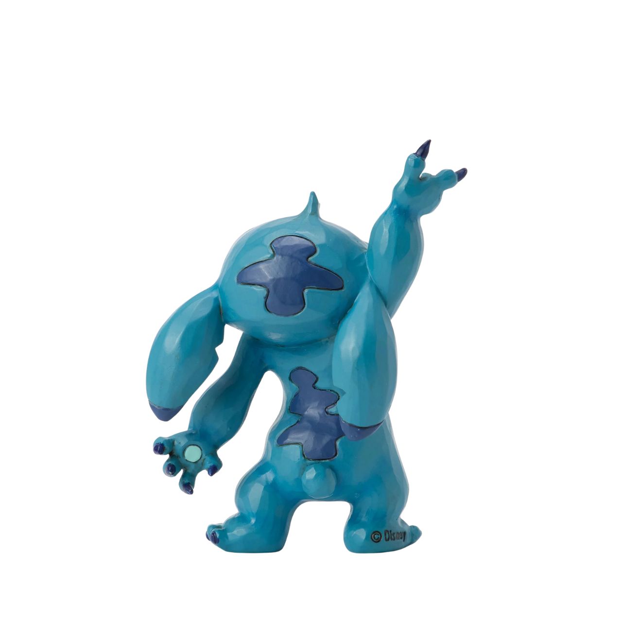 This lively Jim Shore design captures Stitch's playful spirit as he dances with rosemaling on his belly and patterned ears. Whether it's the hula or Elvis, his carefree moves are full of charm and mischief.