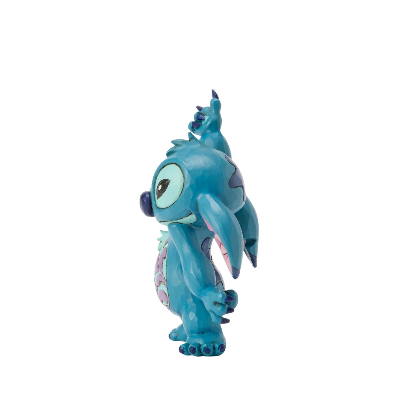 This lively Jim Shore design captures Stitch's playful spirit as he dances with rosemaling on his belly and patterned ears. Whether it's the hula or Elvis, his carefree moves are full of charm and mischief.