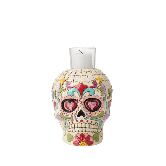 Designed in the iconic style of Jim Shore. This Day of the Dead purple skull candleholder is beautifully decorated with lively Mexican inspired pattern and colour. Modelled after a sugar skull. Hand painted in high quality cast stone. Designed by award-winning artist and sculptor Jim Shore for Heartwood Creek.