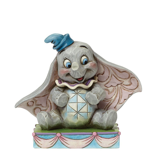 Jim Shore Disney Baby Mine - Dumbo Figurine  Baby Dumbo's sweet smile and innocent wide eyes are perfectly captured by award winning artist and sculptor, Jim Shore. The figurine is made from cast stone. Packed in a branded gift box.
