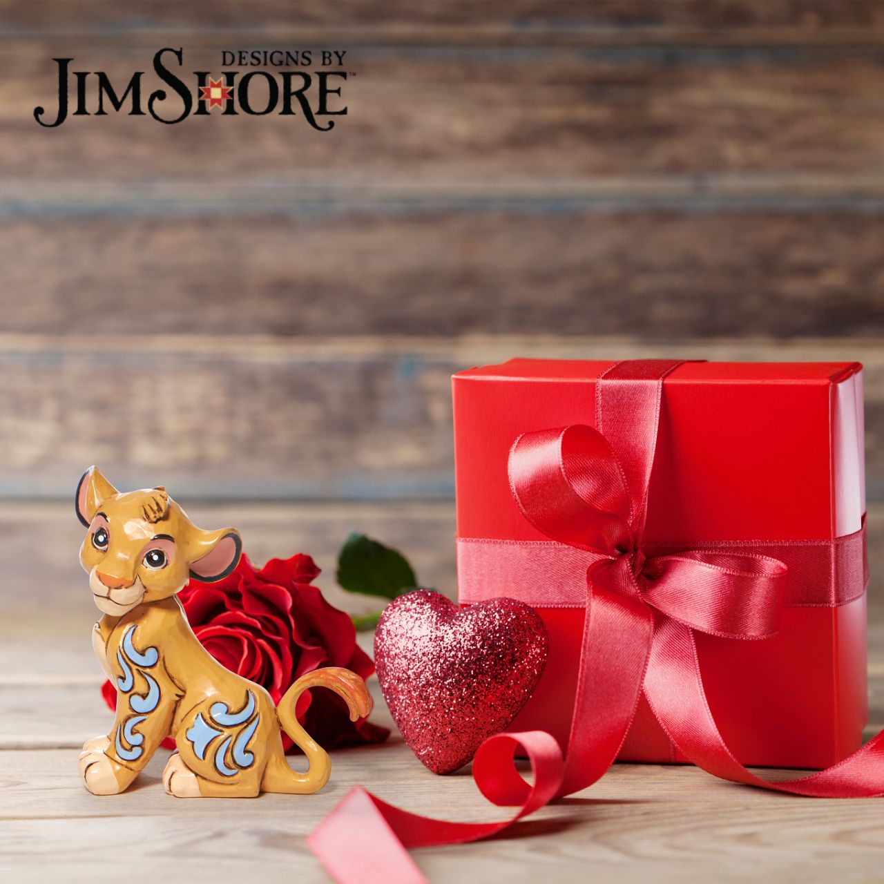 Disney Traditions Simba Mini Figurine by Jim Shore  Simba, the cub to be king, boasts an adorable expression in this Jim Shore statuette. With folksy patterns down his side, he's a vision of playfulness and charm. Looking more like a house cat than a lion, he's the perfect addition to your home.
