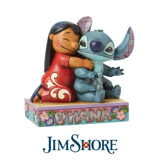 Jim Shore Ohana Means Family Lilo and Stitch Figurine  Lilo and Stitch come together in an exemplary display of Ohana which means family. This heart-warming piece has been designed by award winning artist and sculptor, Jim Shore for the Disney Traditions range.